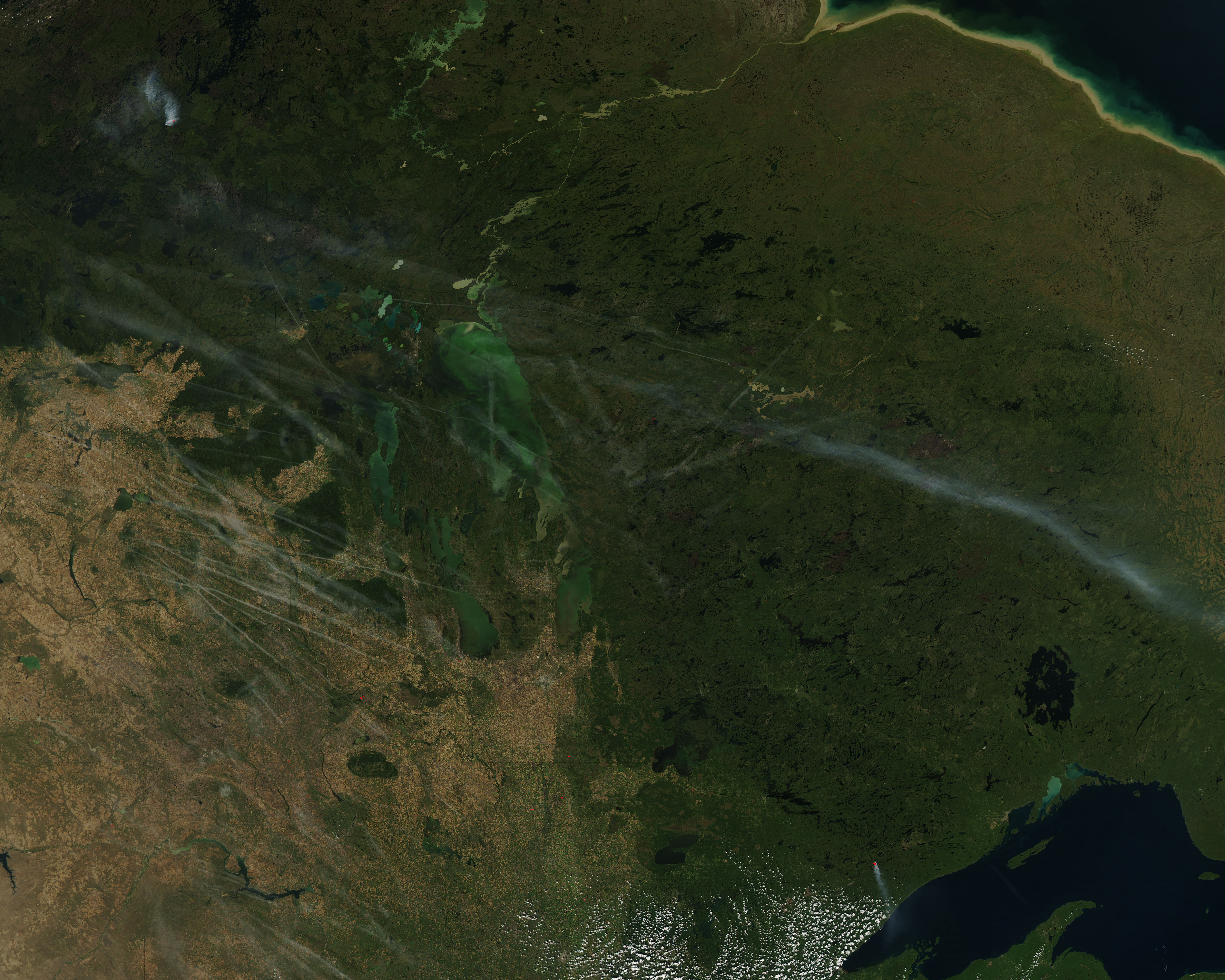 Contrails and smoke over central Canada - related image preview