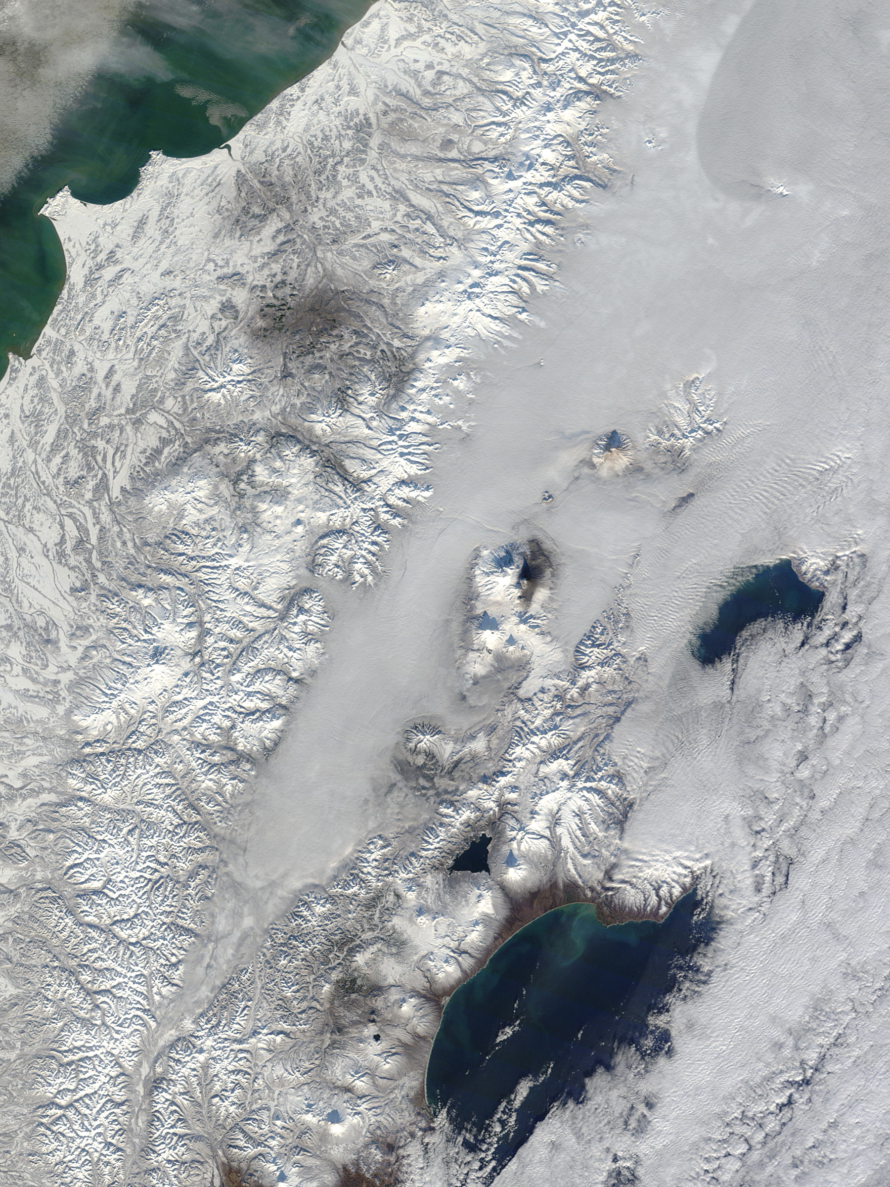 Kamchatka volcanoes rise above low clouds, eastern Russia - related image preview