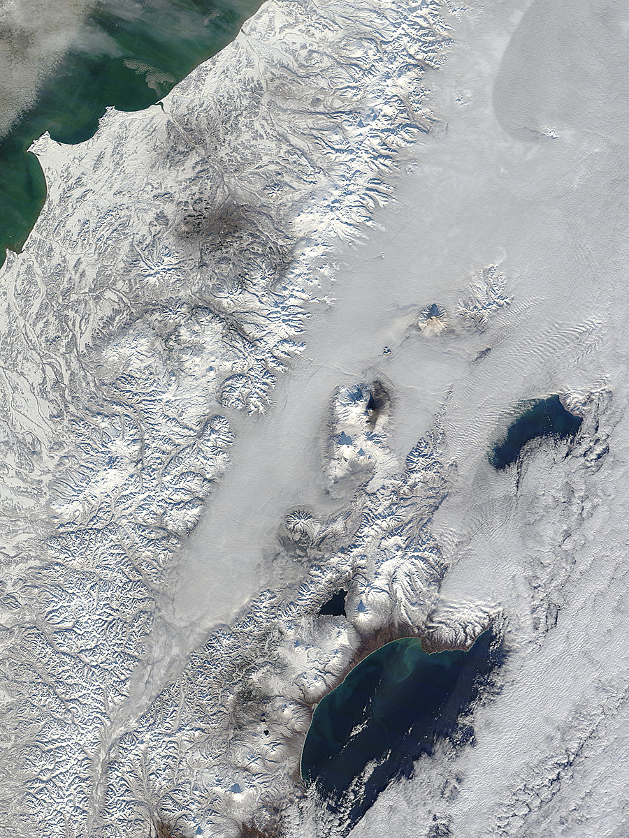 Kamchatka volcanoes rise above low clouds, eastern Russia - related image preview