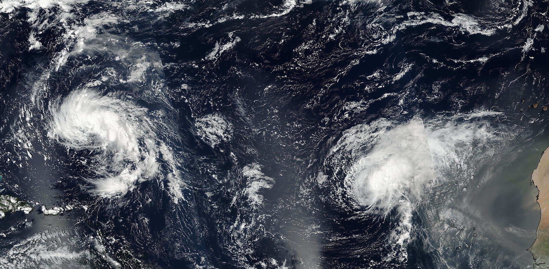 Tropical Storms Karl (12L) and Lisa (13L) in the Atlantic Ocean - related image preview