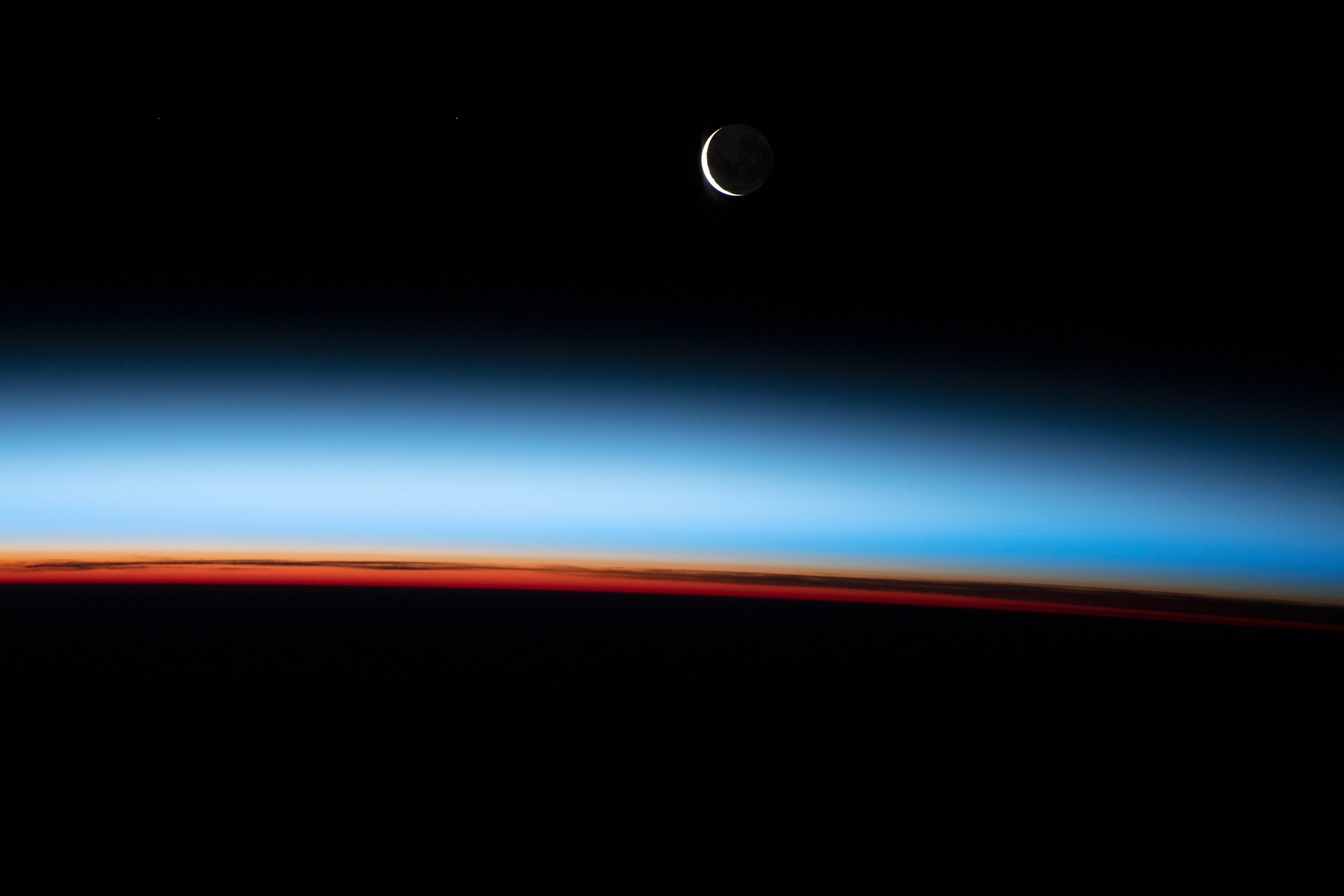 Earth’s Limb with a Crescent Moon - related image preview