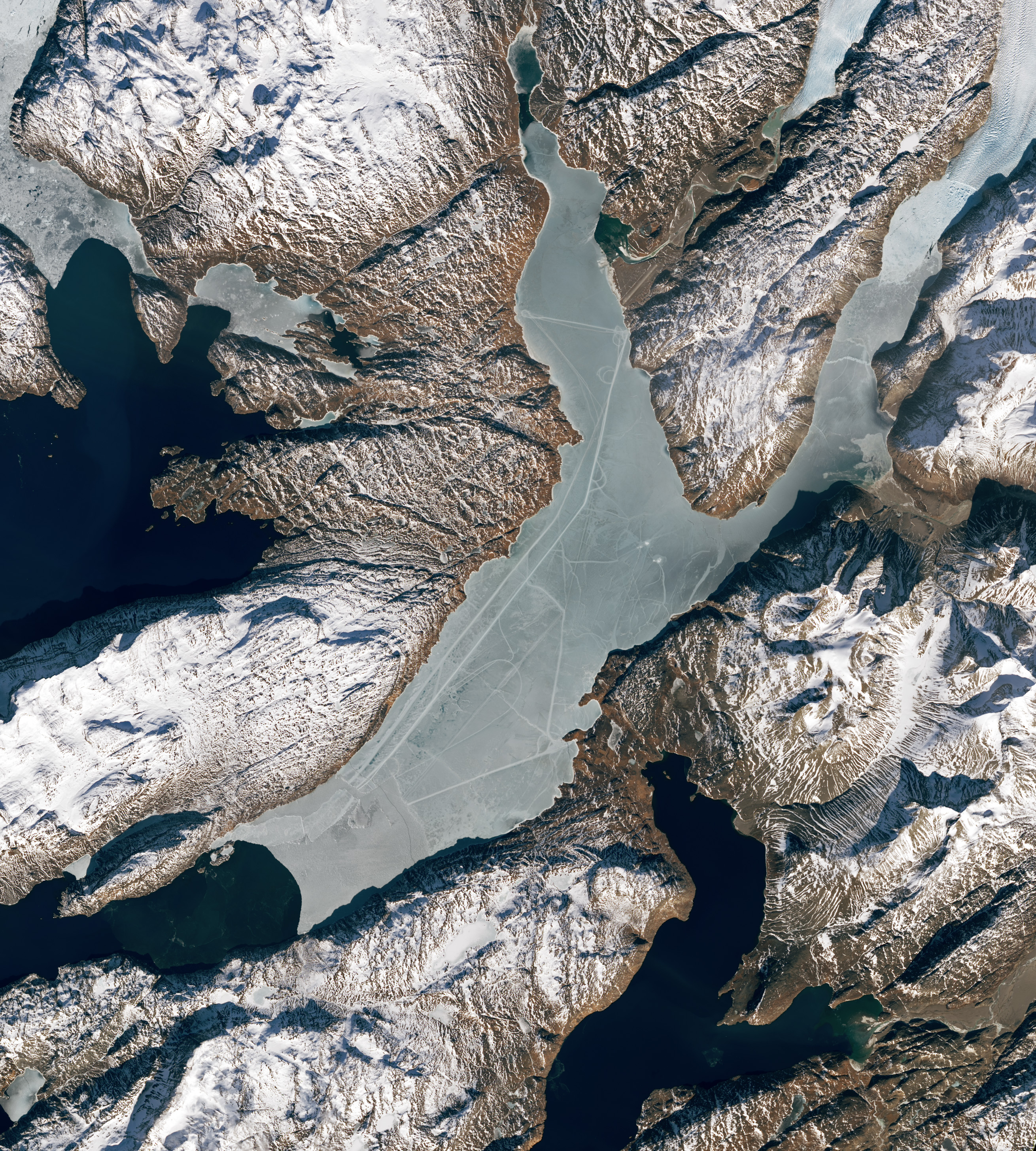 Greenland, East Greenland, Aerial view of Ammassalik island and fjord with  pack or drift ice stock photo