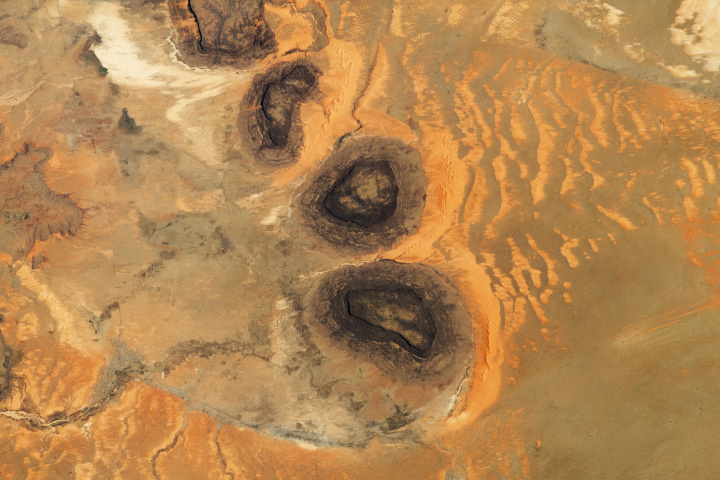 Black Mesas and Sand Dunes in Mauritania