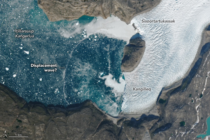 Ephemeral Arc Spans Greenland Fjord - related image preview