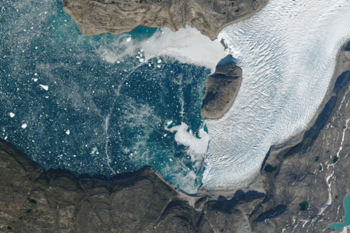 Ephemeral Arc Spans Greenland Fjord