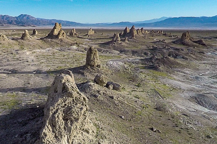 An aerial photograph shows the Trona Pinnacles from above. These spires of calcium carbonate are a visually dramatic example of an evaporite mineral that formed when lake levels were much higher and springs bubbled up from the lake bed.