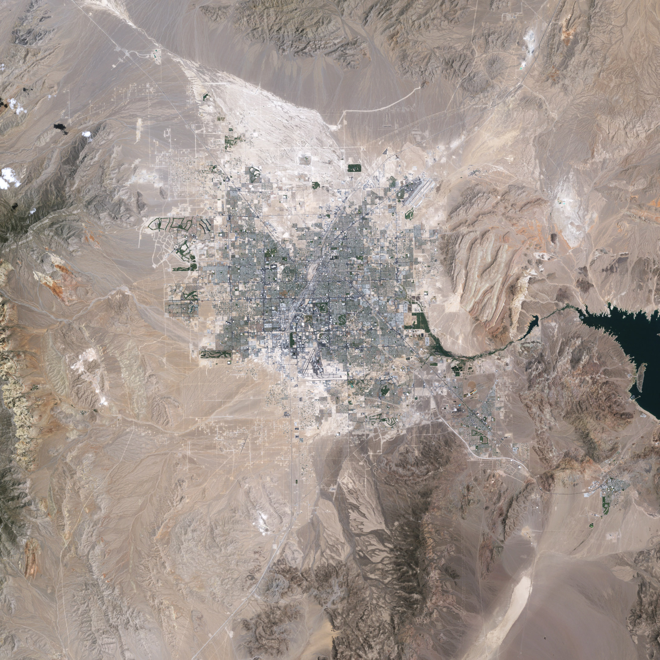 The City in the Desert, The city grid of Las Vegas rises from the Nevada  desert., Las Vegas
