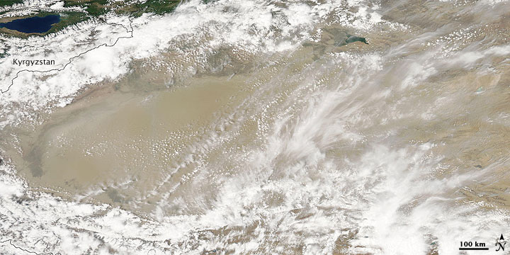 Dust and Clouds over the Taklimakan Desert