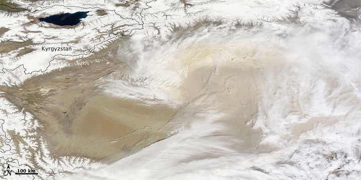 Dust and Clouds over the Taklimakan Desert