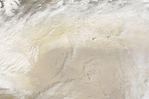 Dust and Clouds over the Taklimakan Desert