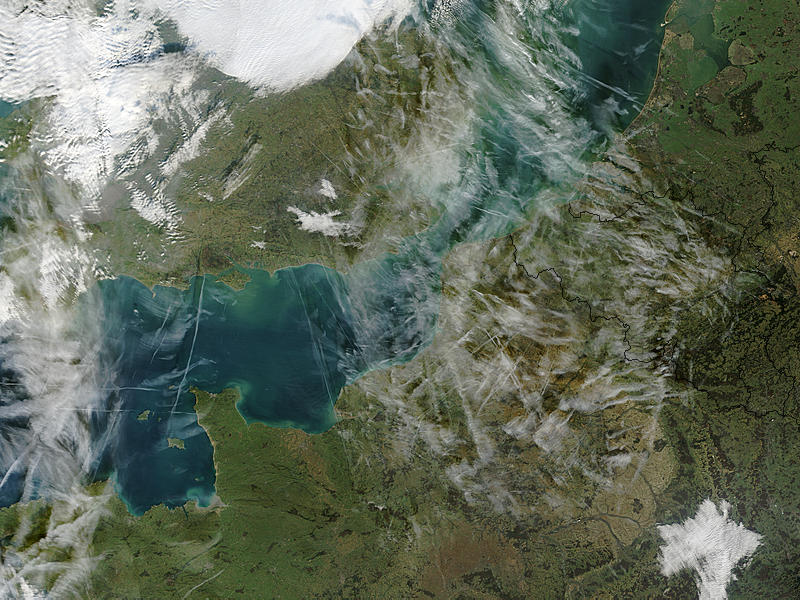 Airplane condensation trails (contrails) across the English Channel - related image preview
