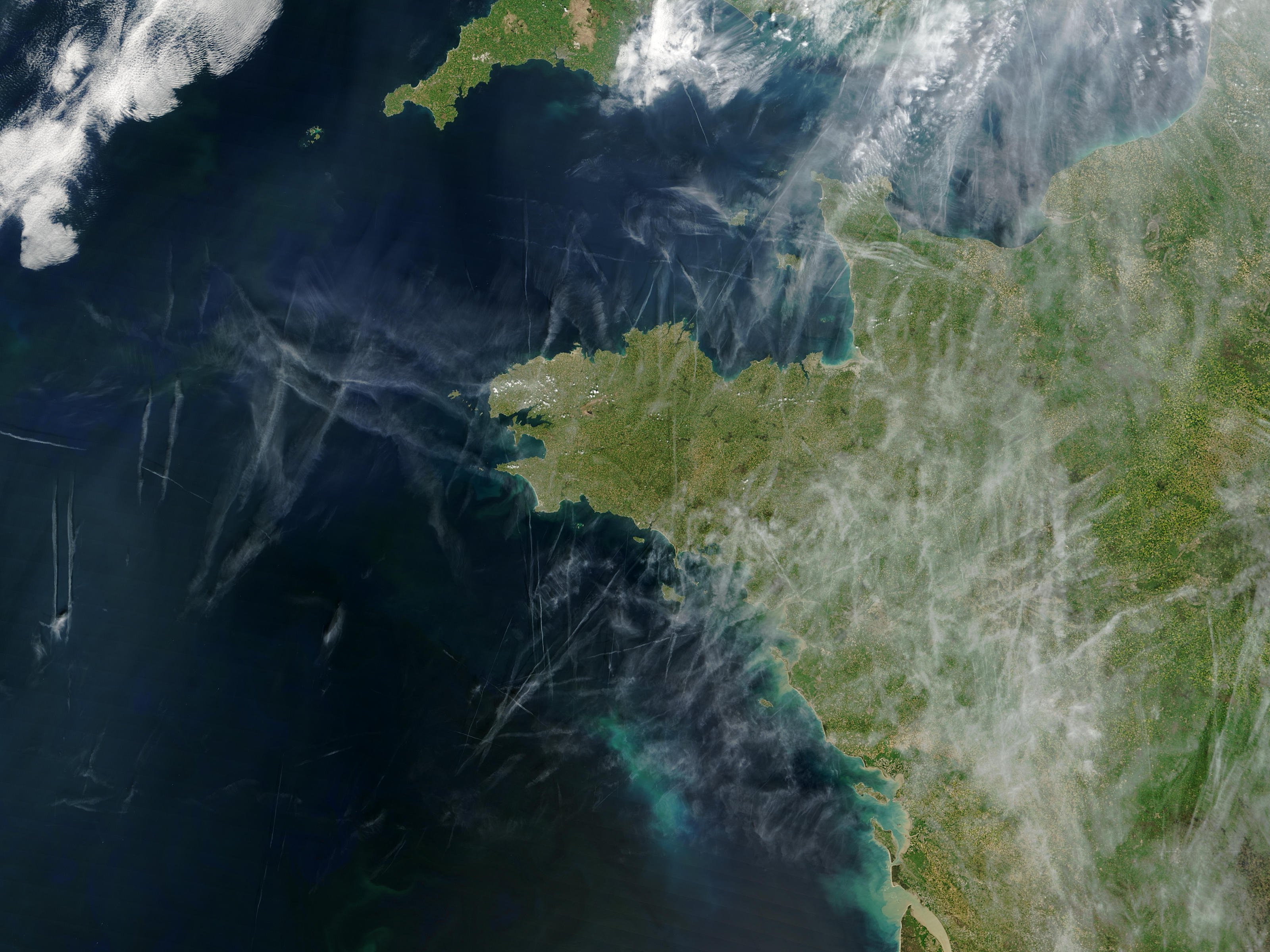 Airplane condensation trails (contrails) over Brittany, France - related image preview