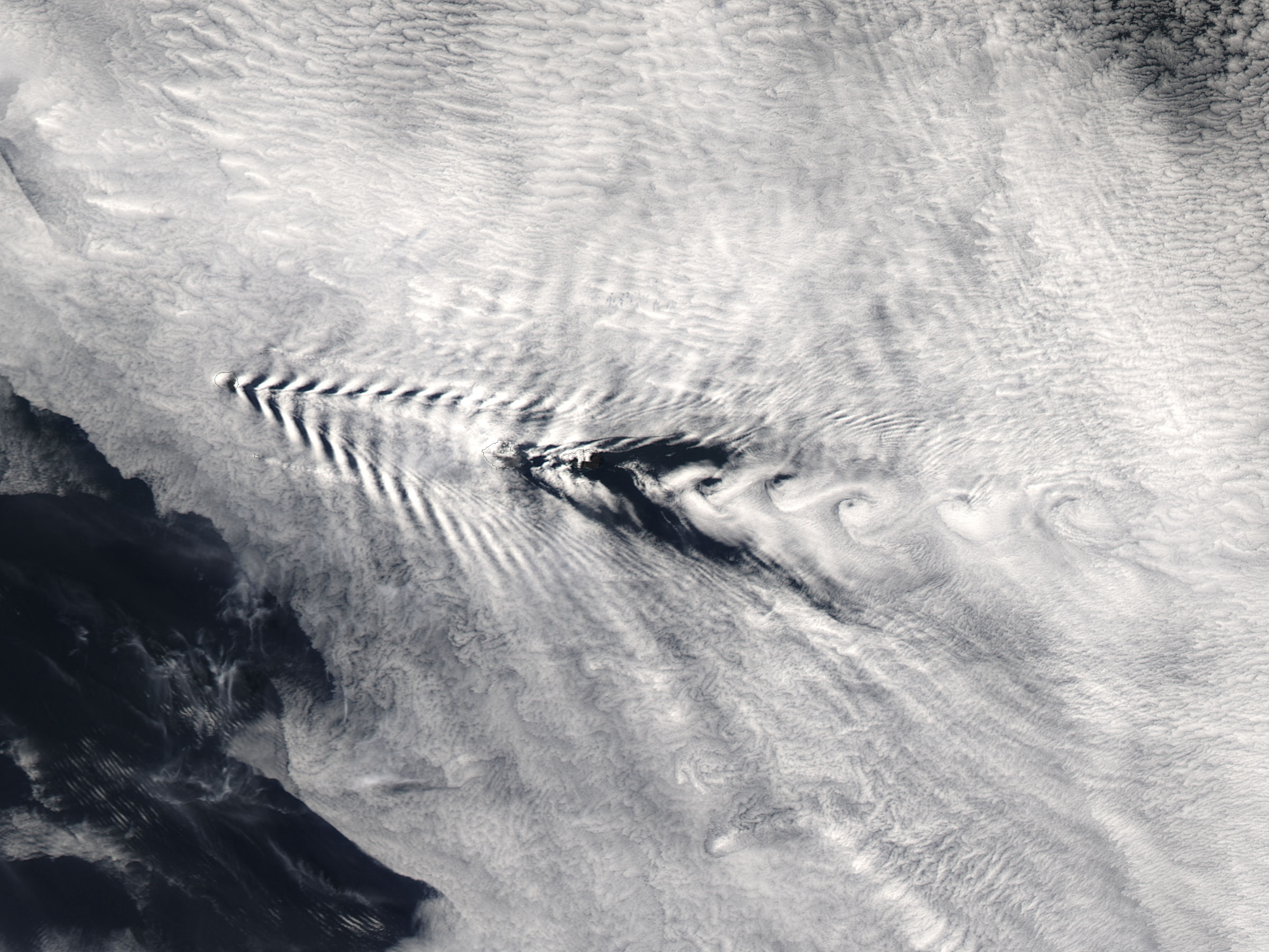 Ship-wave-shaped wave clouds and cloud vortices induced by the Crozet Islands, Indian Ocean - related image preview